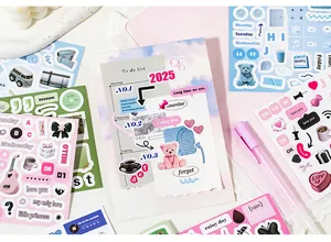 Detail of colorful deco stickers for journaling featuring dates and daily life motifs