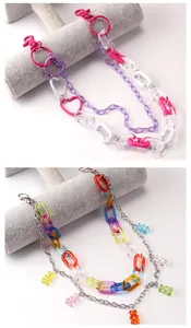 Detailed close-up of colorful acrylic chain links with cute resin bear pendants and charms
