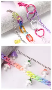 Detail of Y2K acrylic bear and mushroom charms with colorful chunky chain links