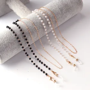 Elegant eyewear chain set with pearls, black beads and gold metal links for women
