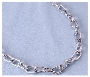 Macro shot of polished silver metal chain links for punk hip-hop style fashion accessories