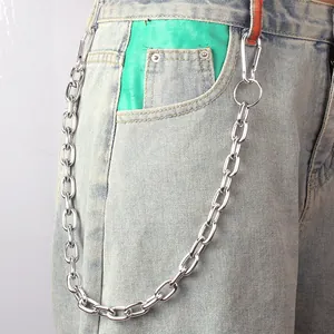 Punk style silver metal trouser chain with large oval links on denim jeans