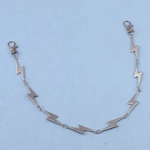 Close-up of a punk-style silver metal lightning bolt chain with lobster clasps for jeans