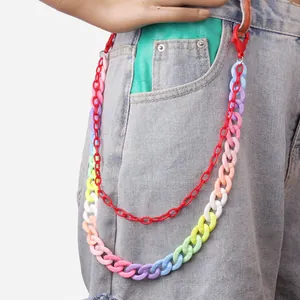 Detail showing double-layered colorful resin pants chains on denim jeans for street style