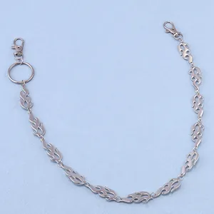 Detail view of silver flame-shaped metal link chain with heavy duty lobster clasps