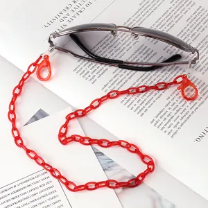 Detail view of red acrylic eyeglass chain with lobster clasps and rubber loops