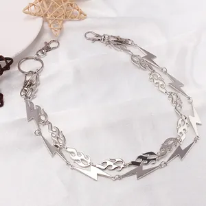 Punk silver double chain pants link featuring flame and lightning pendants on white fabric