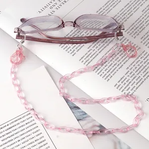 Detailed macro of pink acrylic crystal eyeglass chain with anti-slip silicone rings