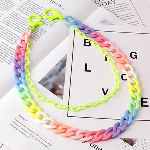 Detail of colorful resin pants chain with double-layered gradient acrylic links and clips