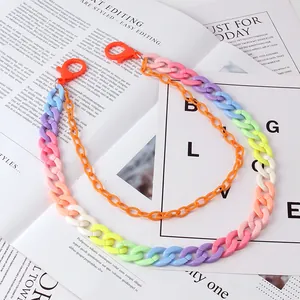 Detail of colorful acrylic resin chain layers with lobster clasps for high-street fashion
