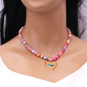 Rainbow heishi bead necklace with colorful heart pendant and gold metal trim