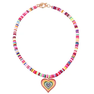 Handmade rainbow clay bead necklace with gold heart pendant and toggle clasp