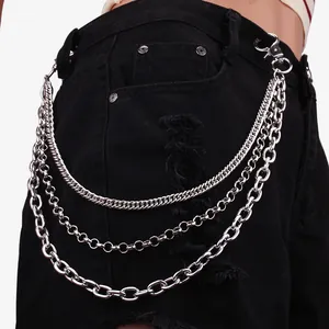 Detail of three-layer silver metal pants chain on black denim shorts with spring hooks