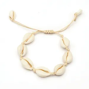 Bracelet bohème fait main en coquillages cauris avec cordon crème réglable pour femme