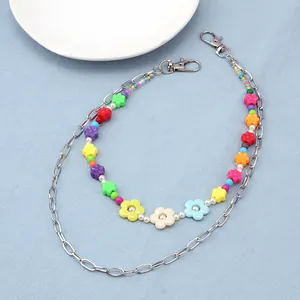 Detail of colorful flower bead and silver metal multi-layer chain with lobster clasps