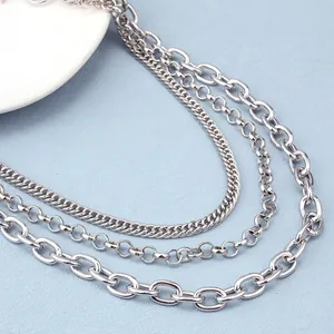 Close-up of triple-layered silver metal hip-hop waist chain with varying link textures
