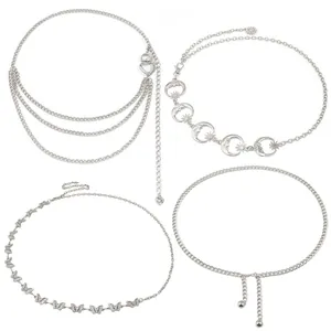 Set of four silver metal waist chains featuring heart, sun, moon and butterfly charms