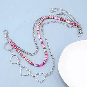 Detail of multi-layer hip-hop trousers chain with heart charms and colorful beads