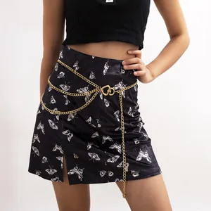 Fashionable gold multi-layer chain belt with heart buckle on butterfly print skirt
