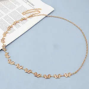 Detail of gold butterfly waist chain with sparkling rhinestones and adjustable lobster clasp