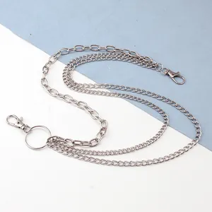 Detailed view of silver triple-layered metal hip chain with lobster clasps and large ring