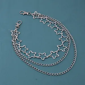 Detail of silver triple-layered metal waist chain featuring hollow star charms and lobster clasps