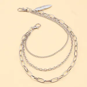 Detail of triple-layer silver metal pants chain with feather pendant and lobster clasps