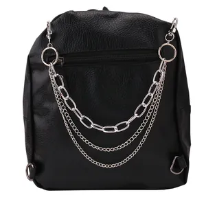 Detail showing triple silver chain decoration on black lychee textured leather backpack