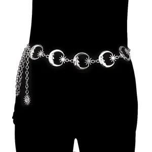 Silver punk waist chain with moon and star links and sun pendant on black background