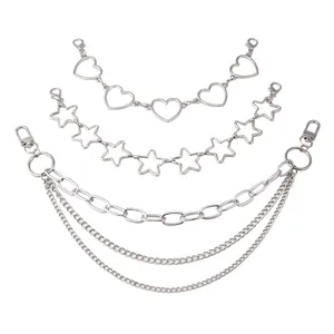 Detail of silver metal bag chain straps with heart, star, and triple layered link designs