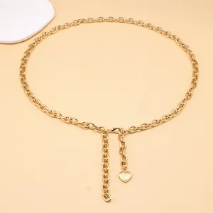 Gold chain waist belt featuring a polished heart pendant and adjustable lobster clasp