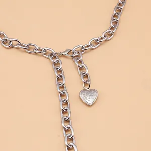 Detail of silver link chain with engraved heart locket featuring I Love You text