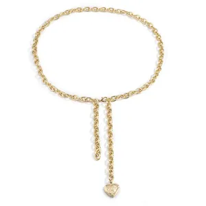 Adjustable gold cross chain body belt featuring an engraved vintage heart pendant