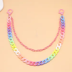 Detail of colorful double-layer acrylic chain with pink lobster clasps for pants or bags
