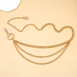 Detail of gold layered waist chain featuring vintage sun moon and star celestial pendants