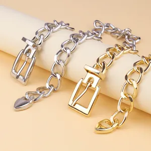 Thick link chain necklace with belt buckle clasp and heart pendant in gold and silver