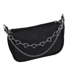 Black faux leather baguette bag with cartoon embossing and dual silver heart chains