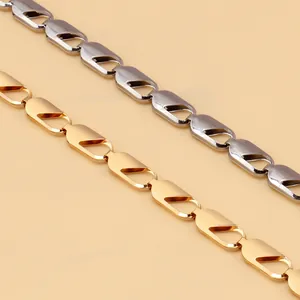 Detailed macro view of hollow snake-bone pattern metal chains in gold and silver finish