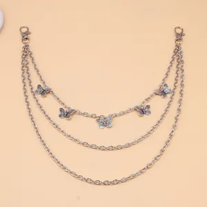 Detail of multi-layer hip-hop silver alloy pant chain with five butterfly charms
