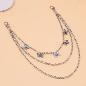 Close-up of triple-layered silver butterfly pants chain with metal lobster clasps
