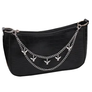 Black crocodile pattern crossbody bag with silver bird chain and metal ring details