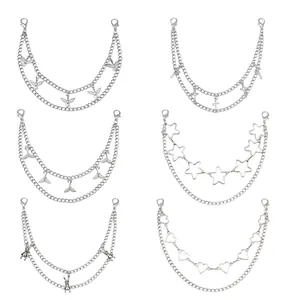 Detail of silver double-layered metal chains with various charms for bags and pants