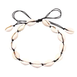 Macro shot of handmade Hawaiian shell necklace with woven black fiber knots and shells