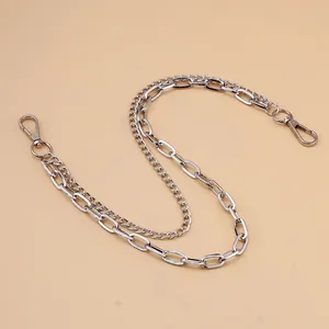 Detail of silver double-layered metal trousers chain with lobster clasps and punk style