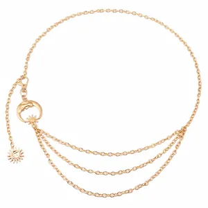 Detail of moon and sun pendants on a layered gold metal waist chain with exact dimensions