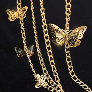 Multi-layer gold metal waist chain with hollow butterfly pendants on black velvet