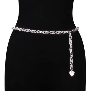 Detail of silver layered chain body belt featuring heart pendant with a white pearl insert