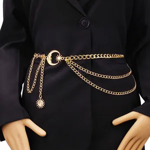 Gold layered waist chain belt featuring moon and sun pendants on a black suit jacket