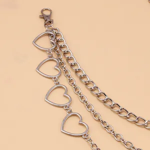 Detail of three-layer silver metal pants chain with hollow heart links and lobster clasp