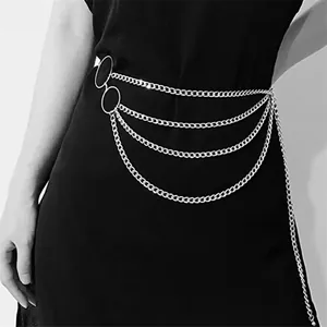 Detail of silver multilayer alloy waist chain with circular rings on a black dress